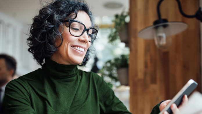 A woman looking at her phone
